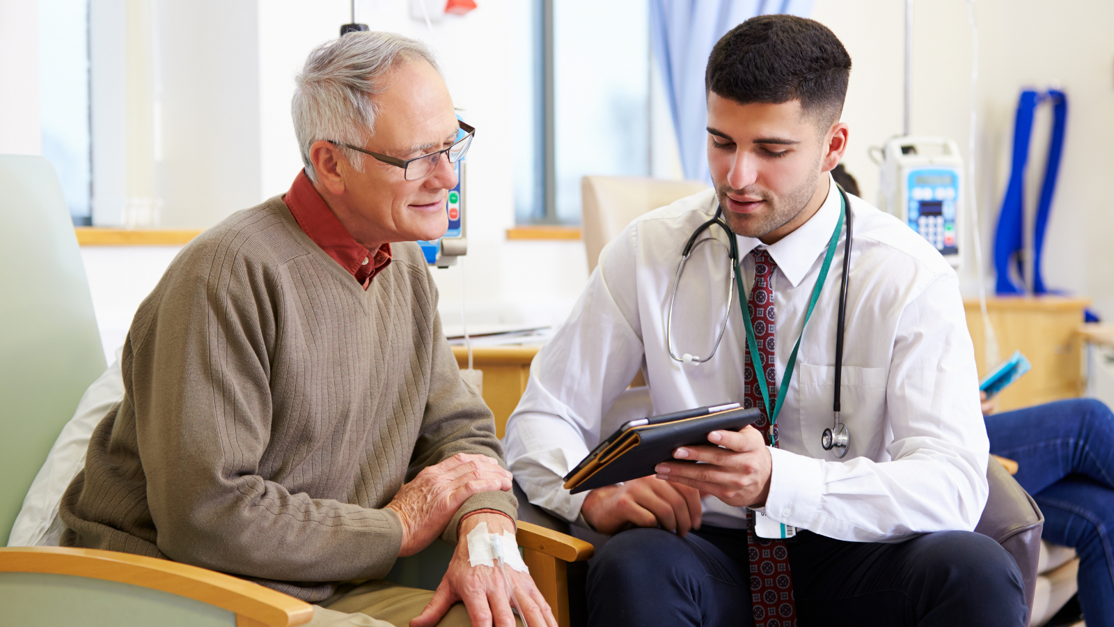 Doctor and patient using a tablet device