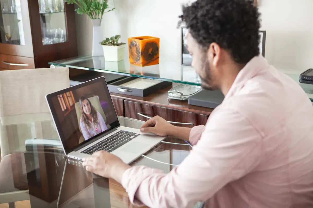 Man using laptop for meeting